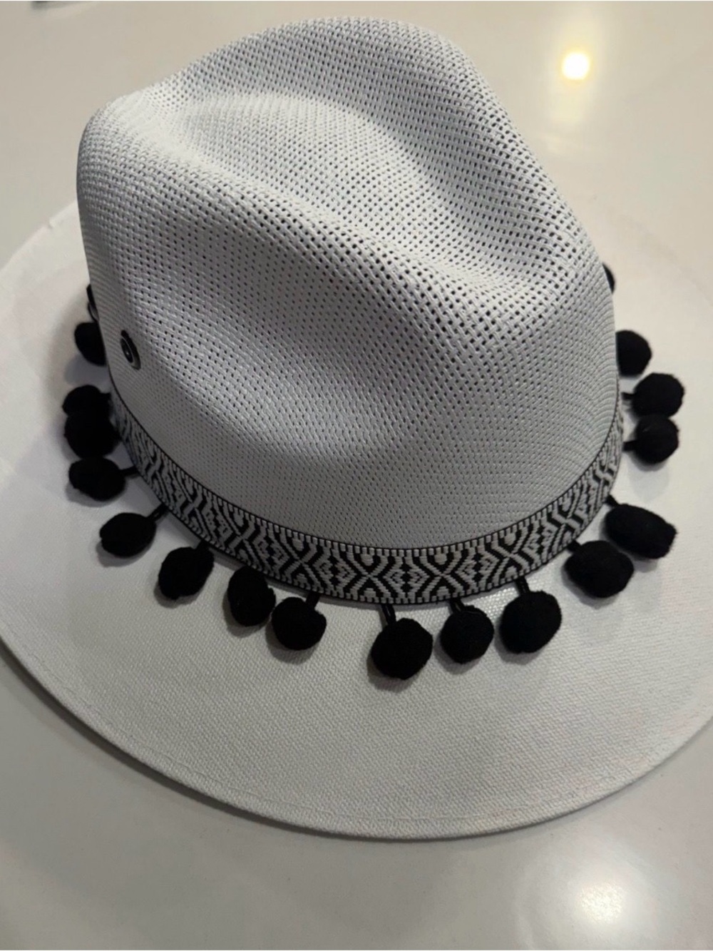 White Fedora Hat with Black Pom-Pom Trim and Patterned Band